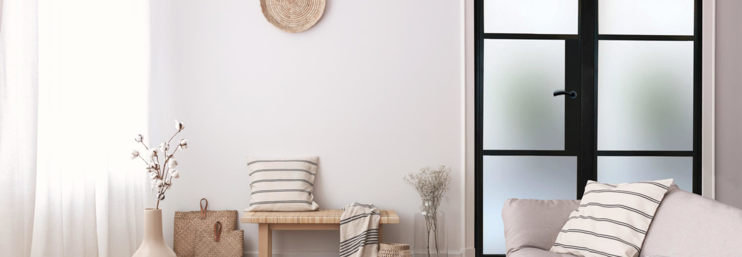 living room with black metal doors